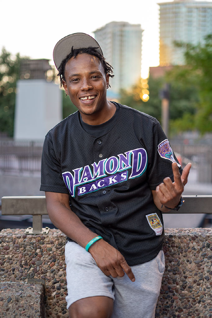 Lamar Mitchell J.R. in a black Diamondbacks jersey outdoors.